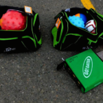 Duffel bags with balls and games inside