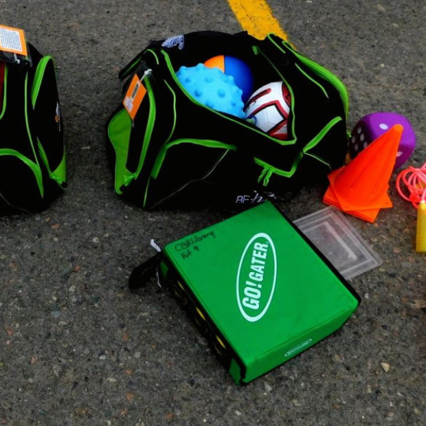 Duffel bags with balls and games inside