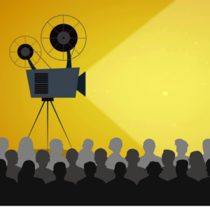 Film projector on yellow background, silouetted audience in foreground
