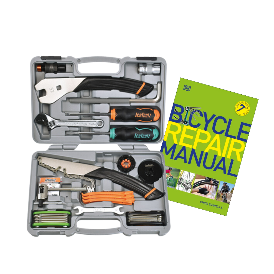 open tool box showing tools included in bike maintenance repair kit alongside the book Bicycle Repair Manual by Chris Sidwells.