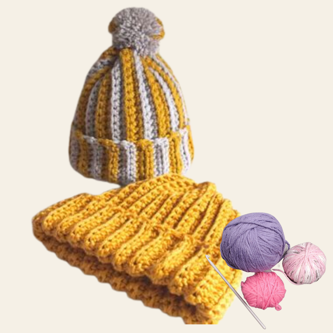 two crochet ribbed toque-style hats with balls of yarn and a crochet hook.