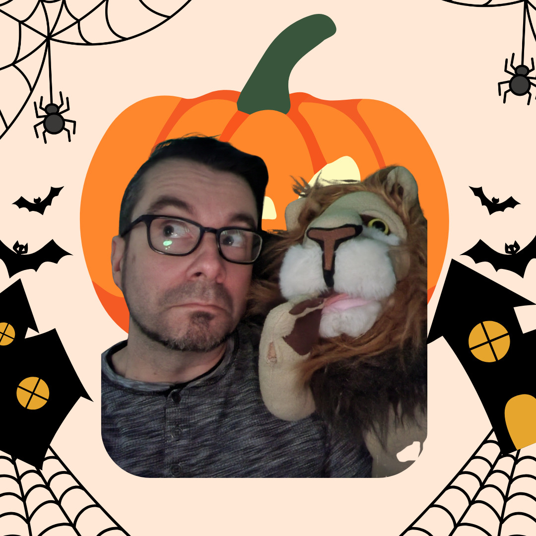 man and lion puppet on halloween themed background