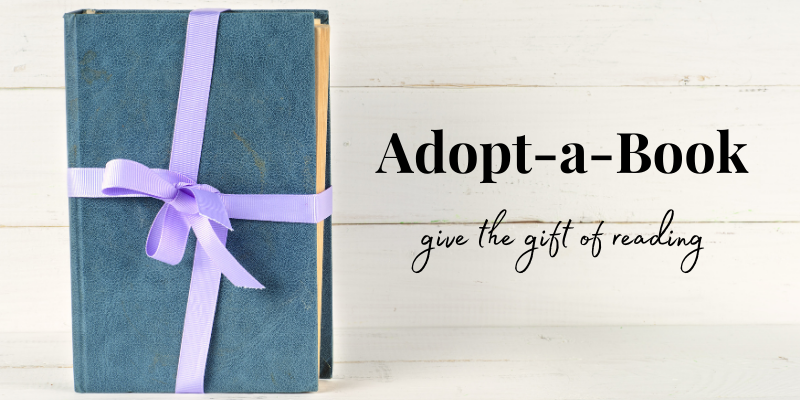 Book wrapped with ribbon for Adopt-a-book campaign